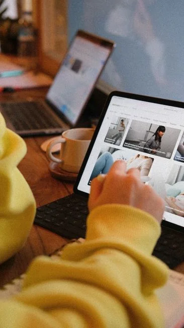 A focused designer works on a user-centric project in a modern office environment.
